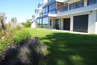 SPLENDIDE APPARTEMENT EN REZ DE JARDIN AVEC VUE LAC ET MONTAGNES A LUTRY